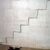 A diagonal stair step crack along the foundation wall of a Olive Hill home