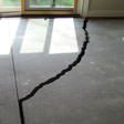 a huge crack in a concrete slab floor in Huntington