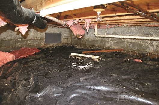 Crawl space with standing water and falling fiberglass batts