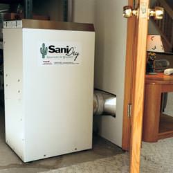 A basement dehumidifier with an ENERGY STAR® rating ducting dry air into a finished area of the basement  in Proctorville