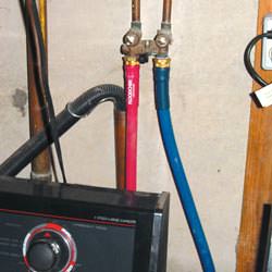 Washer hoses in a basement  in Nelsonville